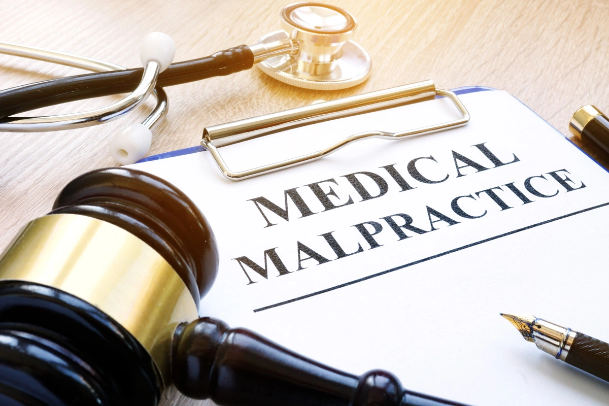 Medical malpractice legal document with judge's gavel and stethoscope on desk, representing healthcare negligence cases handled by Appelblatt & Mazzola LLP in Sacramento California
