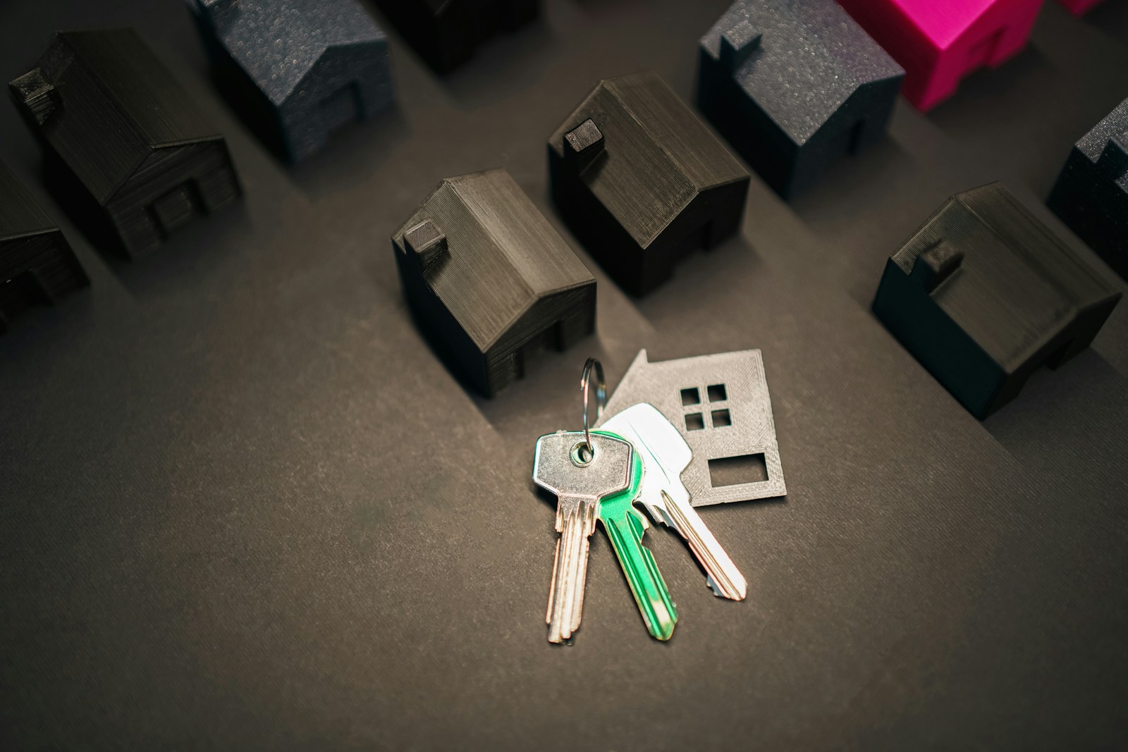 House keys and residential property models representing jointly owned real estate