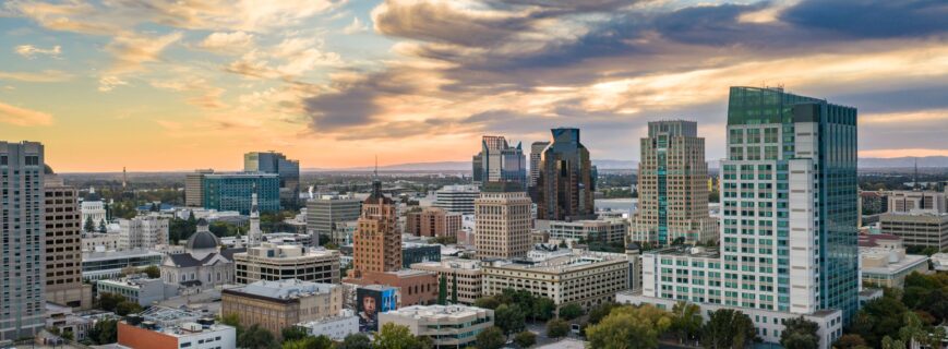 Downtown Sacramento skyline under sunset clouds