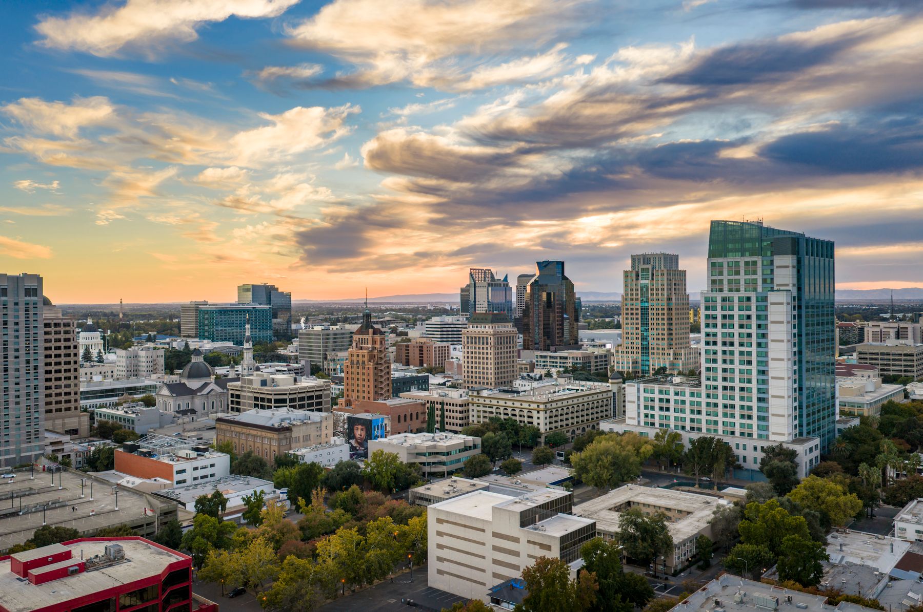 Downtown Sacramento skyline under sunset clouds